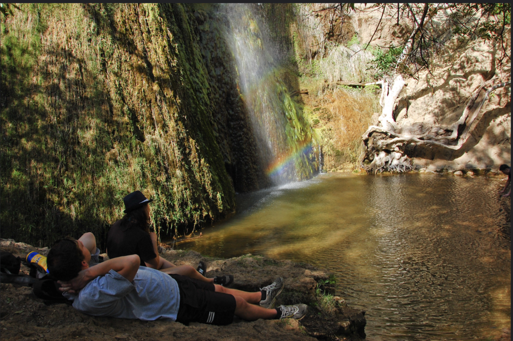 People sitting near Chase Waterfall